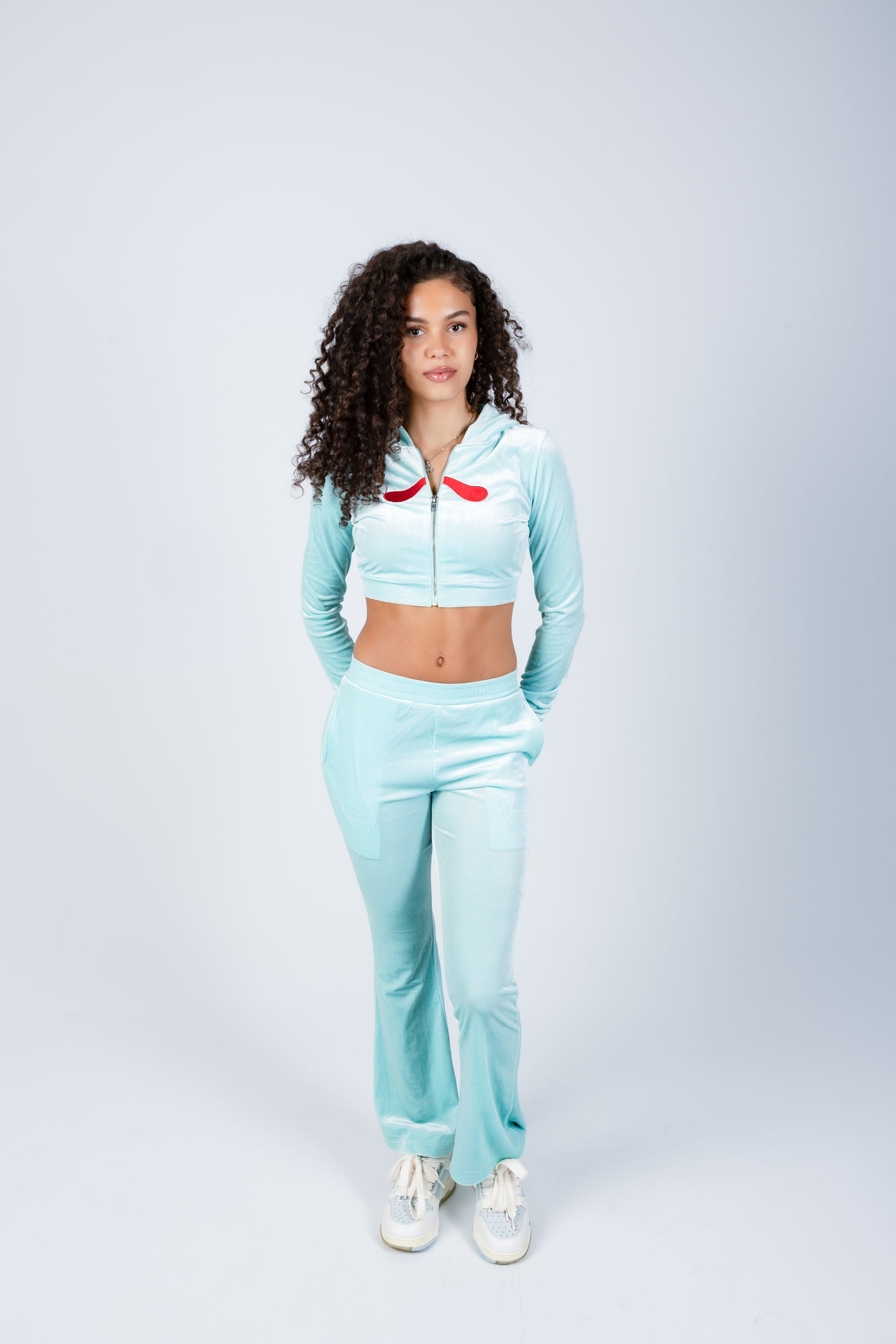 Woman wearing a light blue tracksuit 